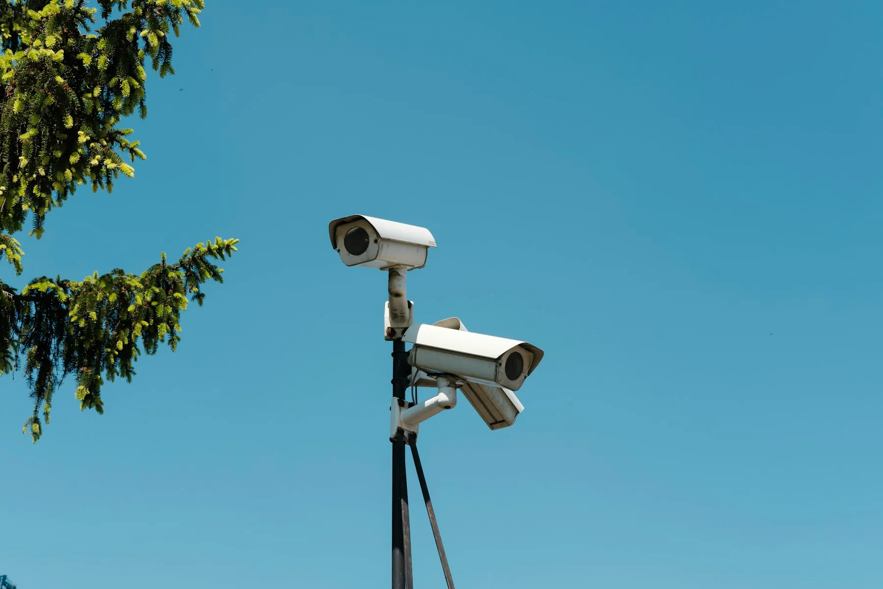 Security cameras mounted on an outdoor pole
